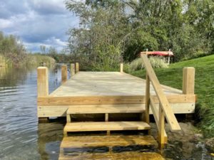 Custom crafted wood dock with wood stairs