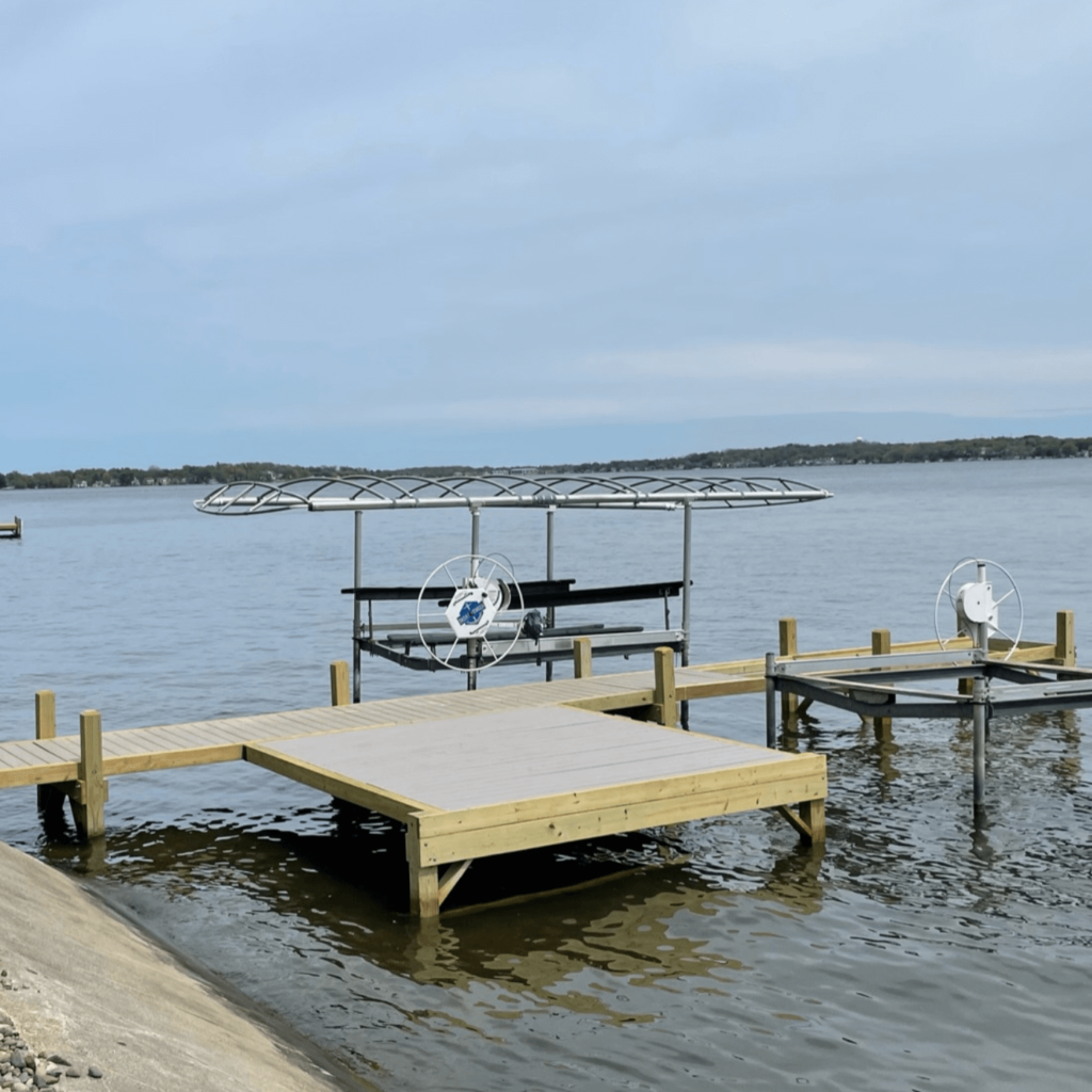 Dock featuring large tanning platform with composite pier tops