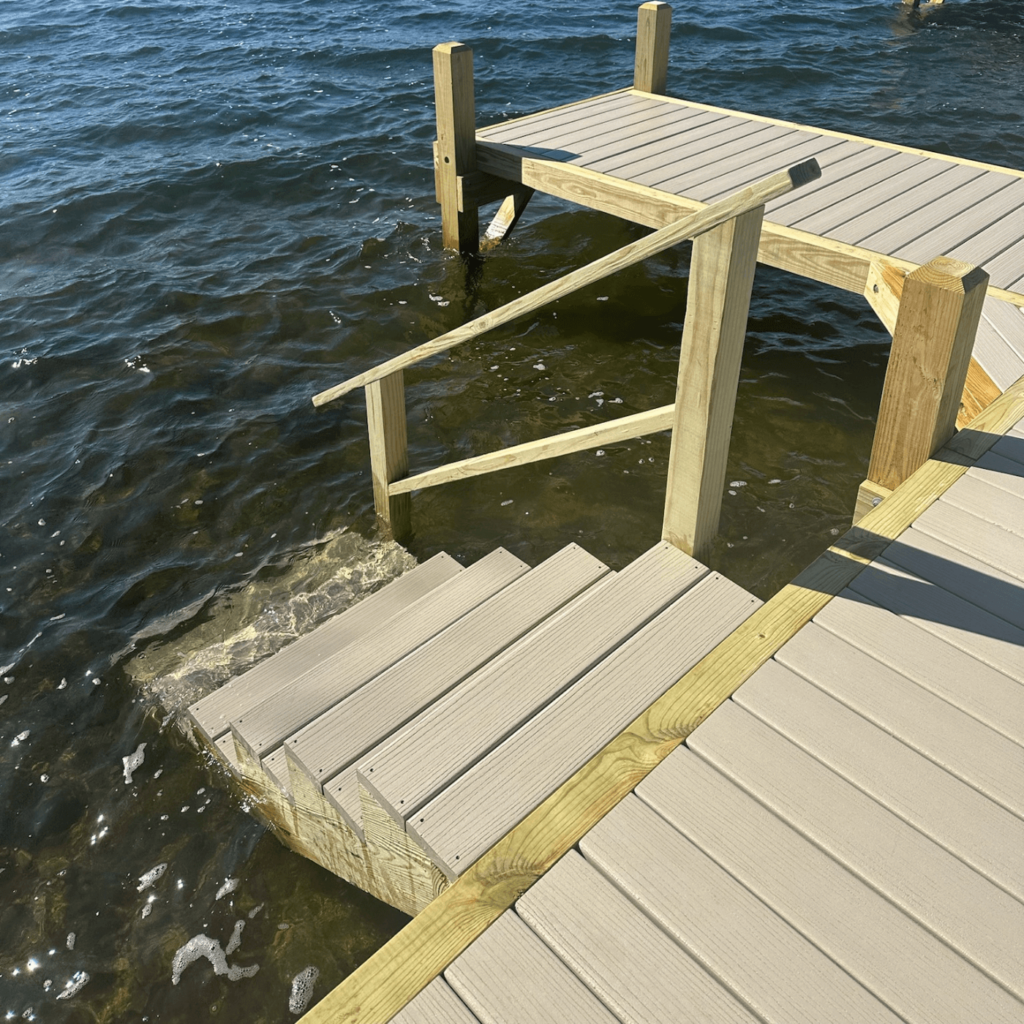 Steps into the water with a handrail for added safety