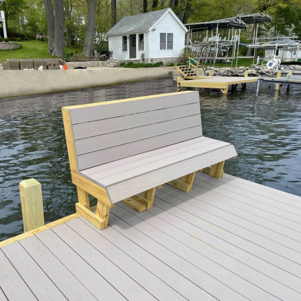 Dock bench seating built into custom dock on Pewaukee Lake by Rock Docks.